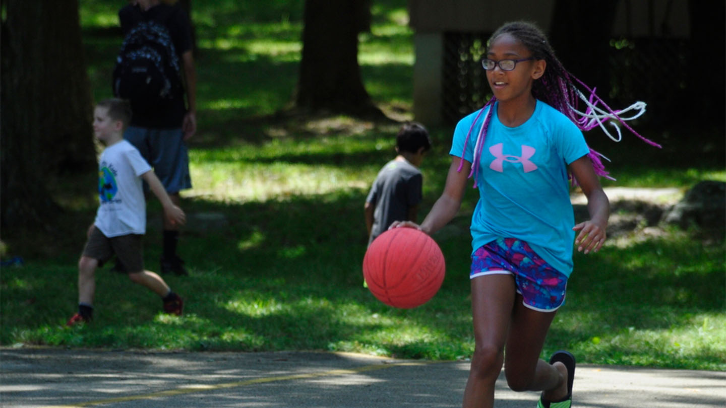 Camper playing basketball