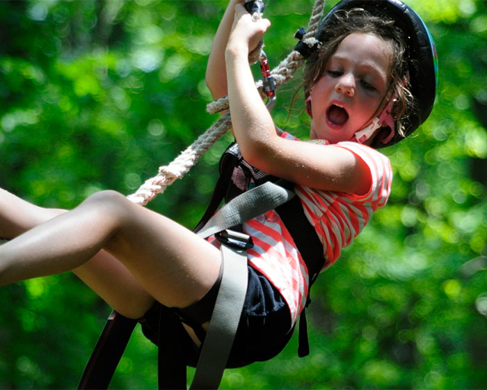 Girl excited on the zip line